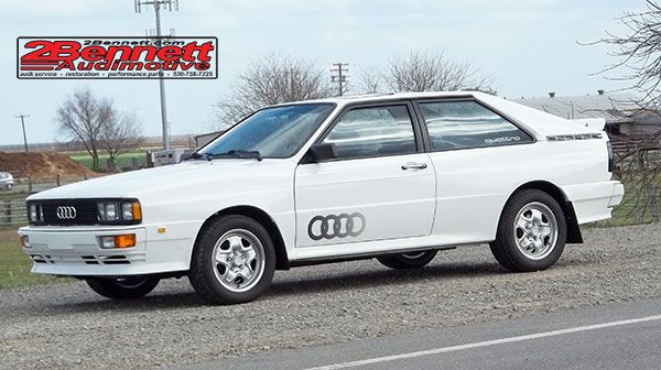 Restored white 1984 Audi Ur-quattro on a country road